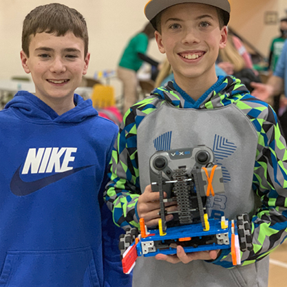  two students with VEX robot